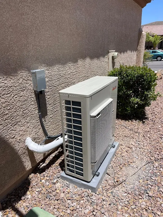 Residential air conditioning condenser unit in Mineola